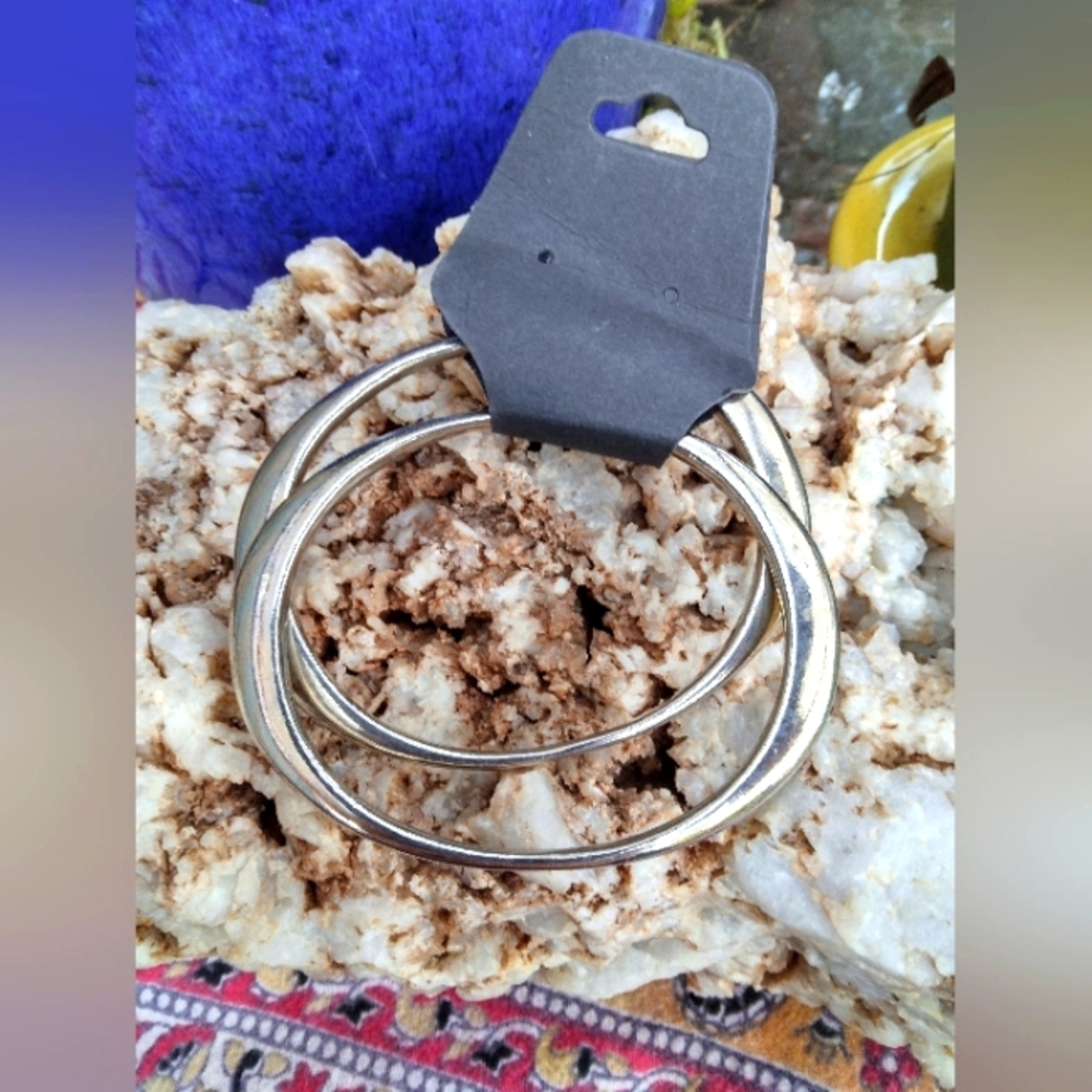 New silver toned bangle bracelets